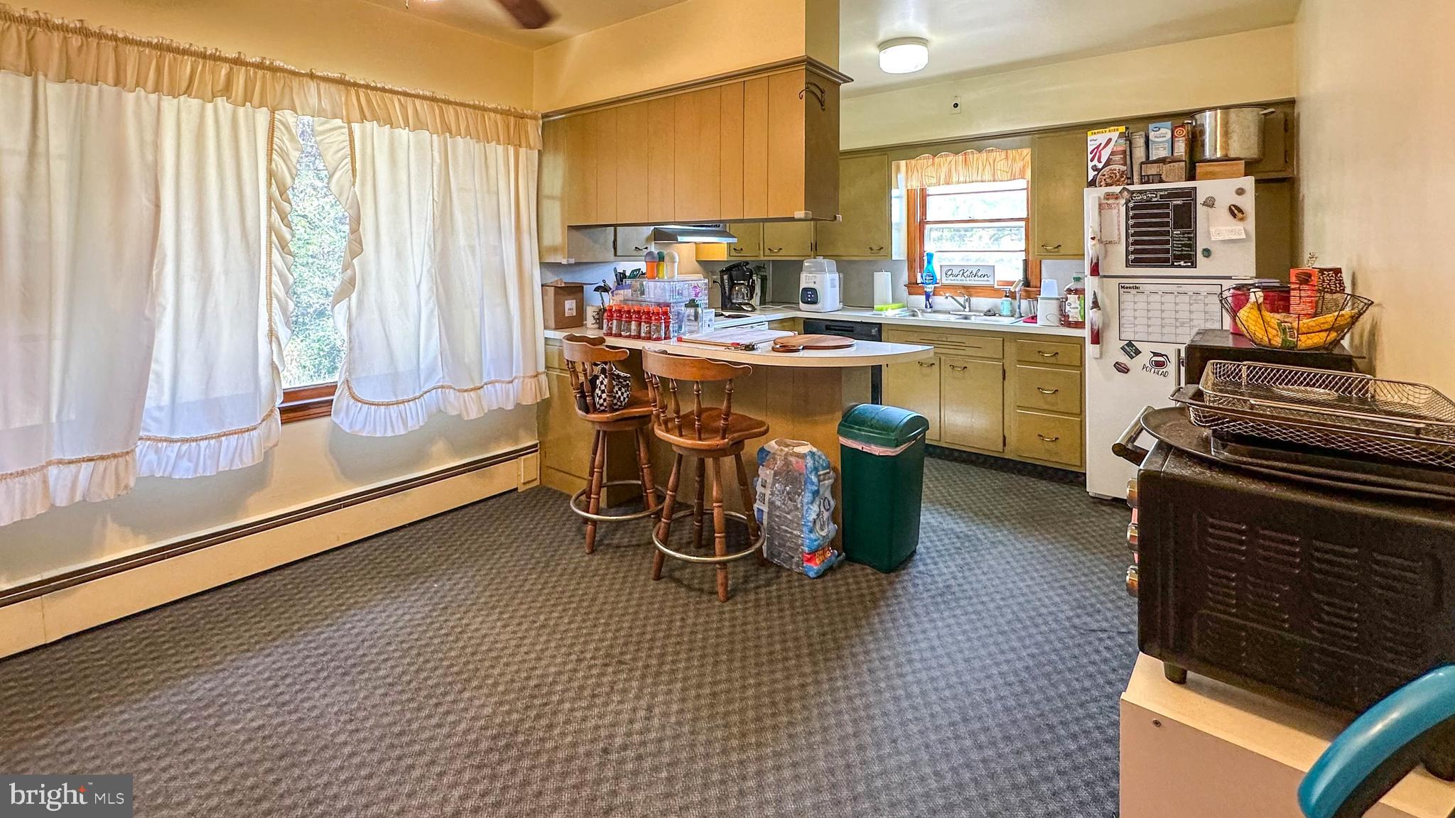 57 Mountain View Road Bethel, PA 19507 - Photo 11 of 31 a kitchen with a sink appliances and cabinets
