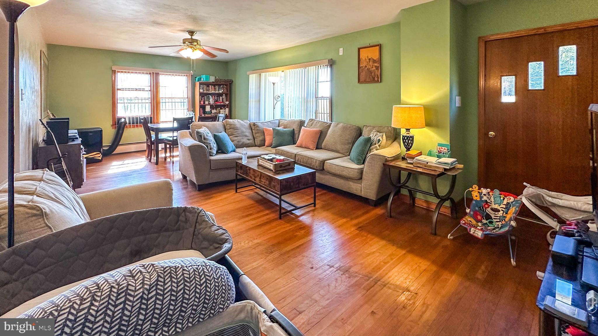 57 Mountain View Road Bethel, PA 19507 - Photo 20 of 31 a living room with furniture floor to ceiling window and wooden floor