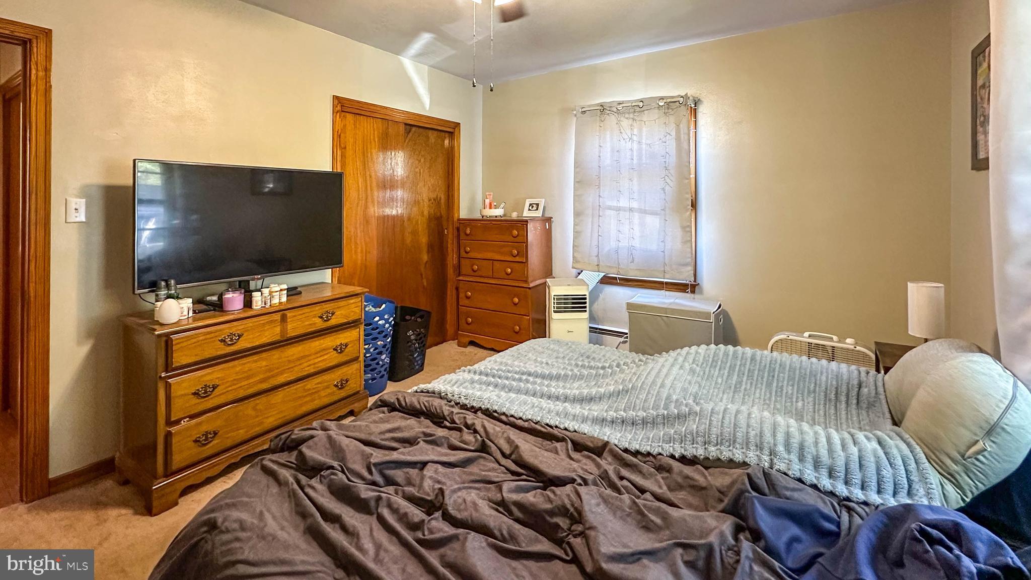 57 Mountain View Road Bethel, PA 19507 - Photo 24 of 31 a bedroom with a bed and flat screen tv
