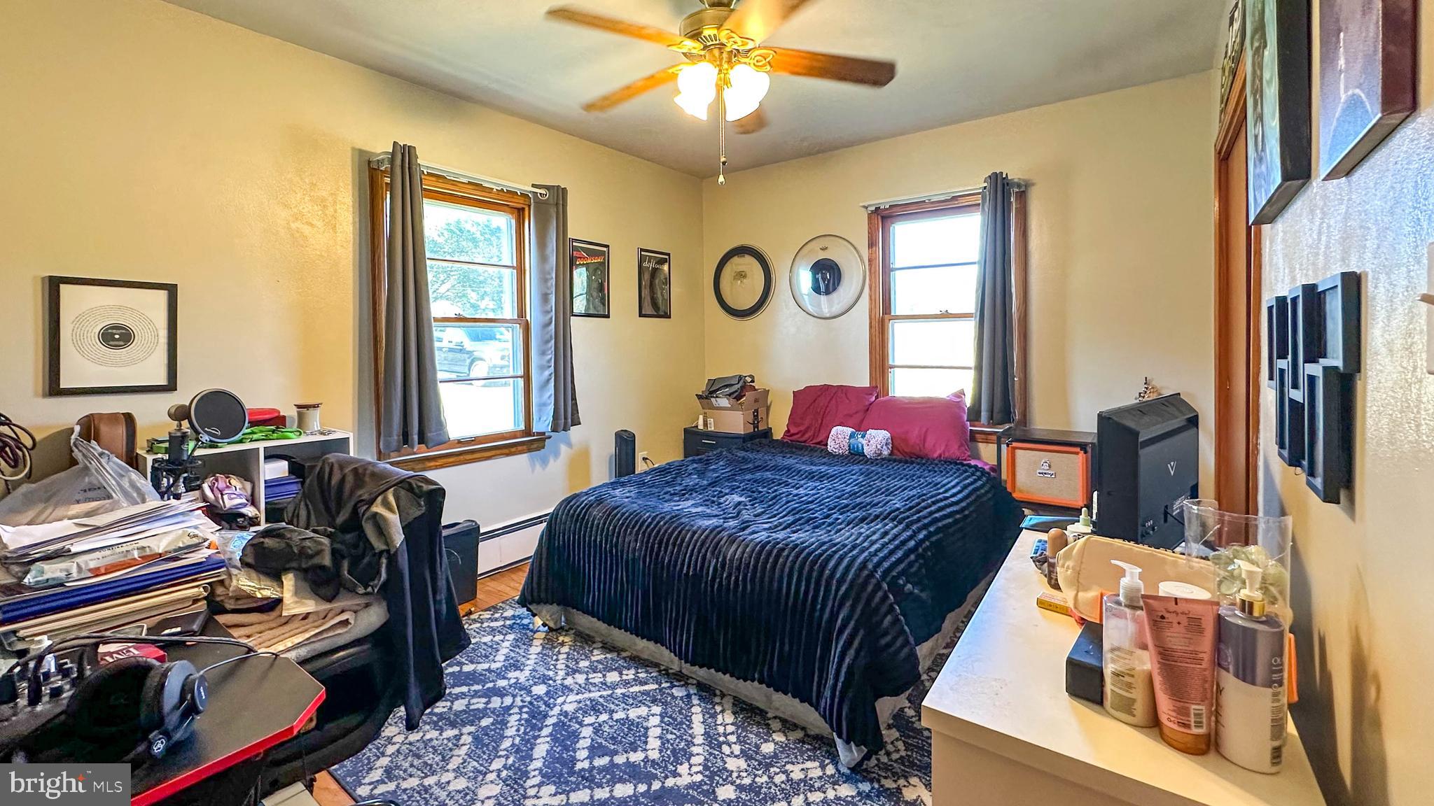 57 Mountain View Road Bethel, PA 19507 - Photo 25 of 31 a bedroom with a bed and a chandelier