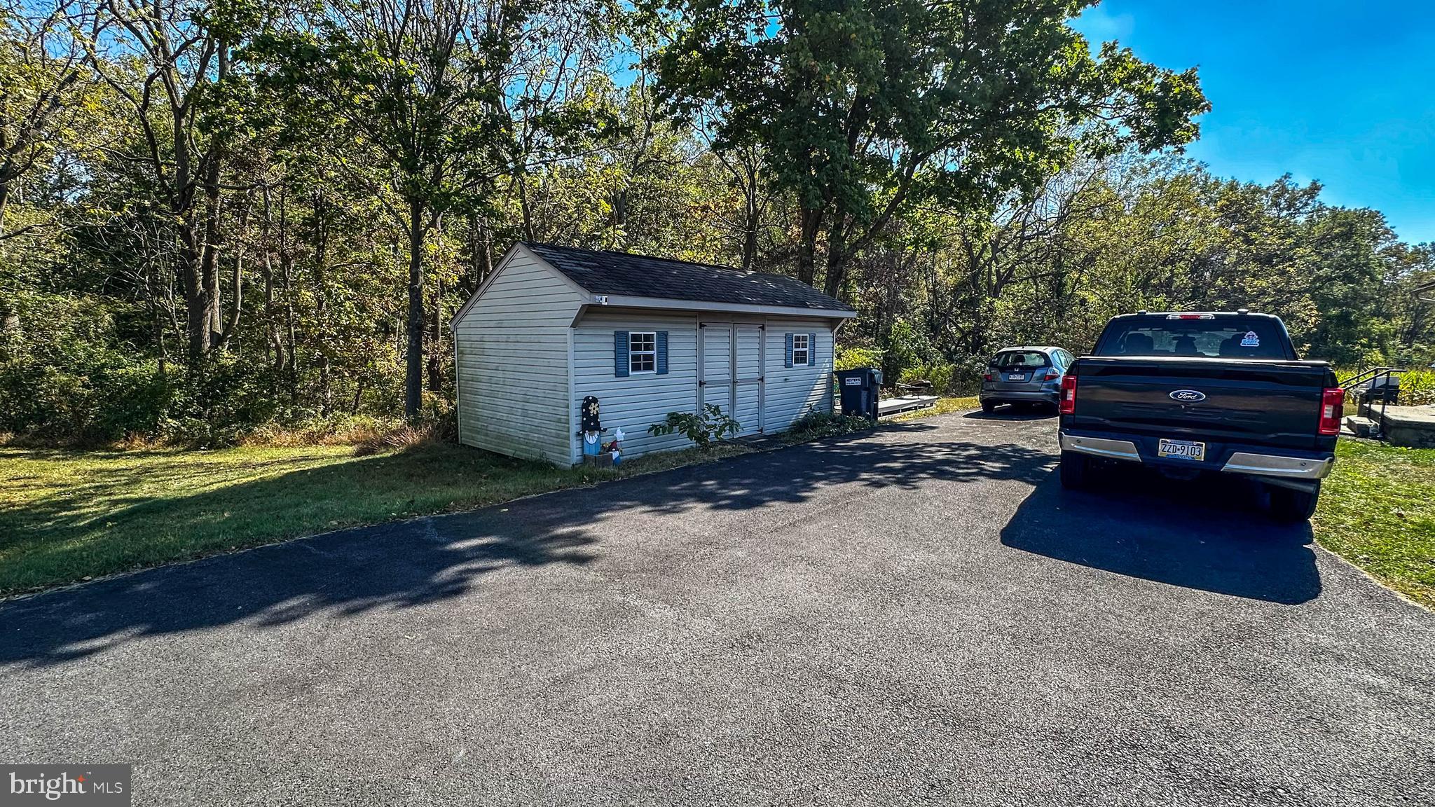 57 Mountain View Road Bethel, PA 19507 - Photo 6 of 31 a wooden bench sitting in front of a house