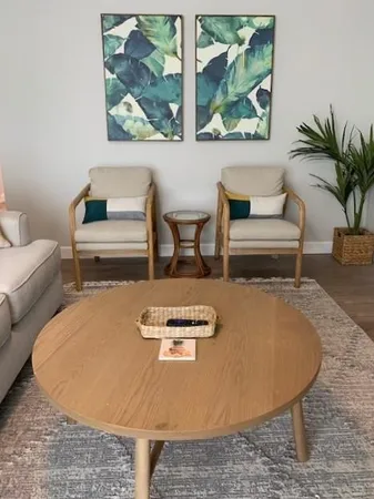 a living room with furniture and a rug