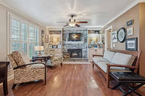 a living room with furniture and a fireplace