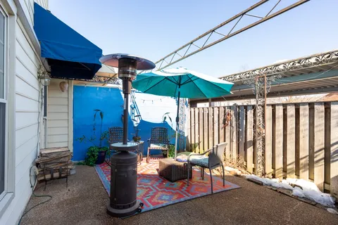 a view of a patio with furniture