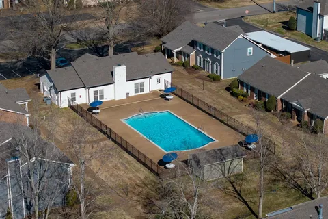 an aerial view of a house with swimming pool
