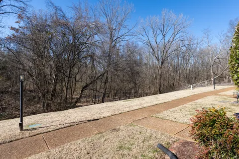 a view of a backyard of the house