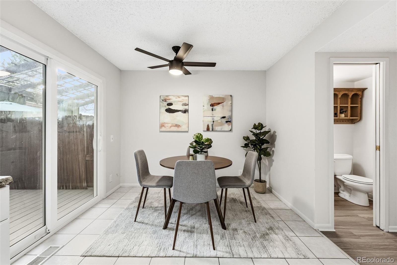 508 South Carr Street, Unit 118 Lakewood, CO 80226 - Photo 17 of 42 a view of a dining room with furniture and a potted plant