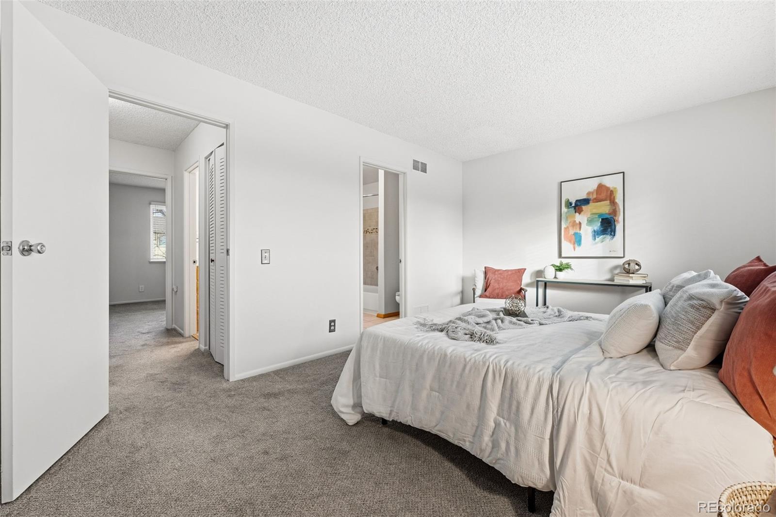 508 South Carr Street, Unit 118 Lakewood, CO 80226 - Photo 21 of 42 a bedroom with a bed and a painting