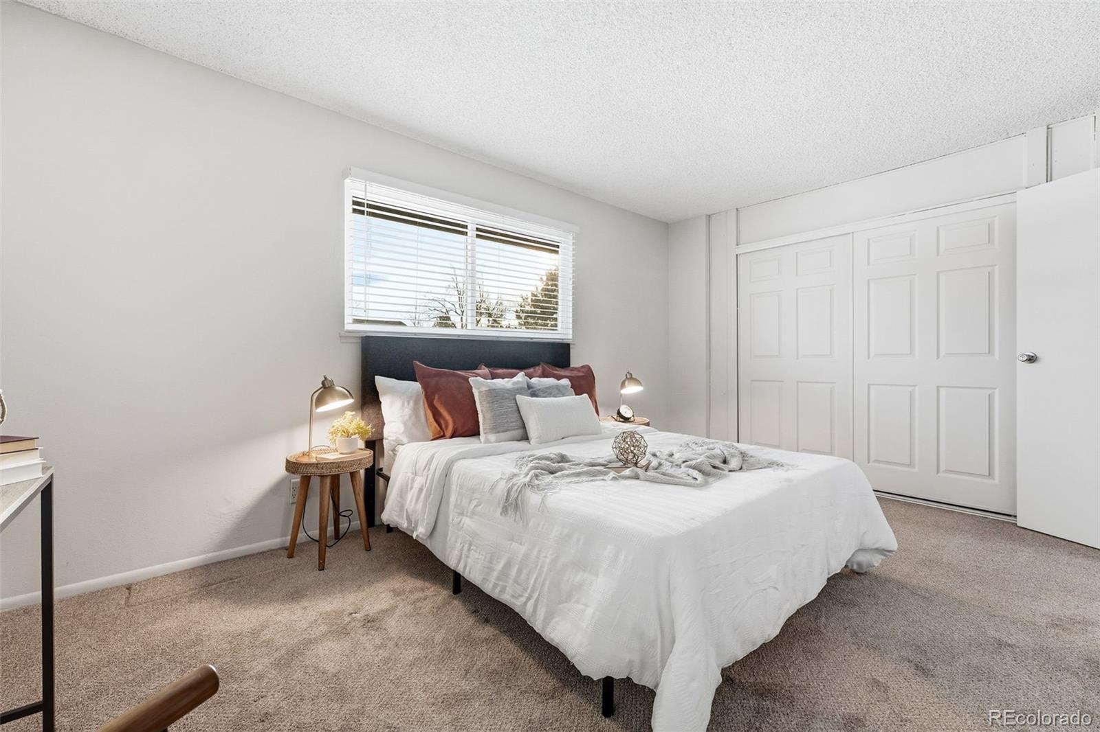 508 South Carr Street, Unit 118 Lakewood, CO 80226 - Photo 22 of 42 a bedroom with bed and a window