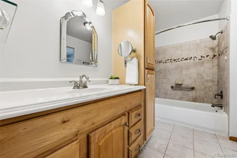 a bathroom with a bathtub and a sink