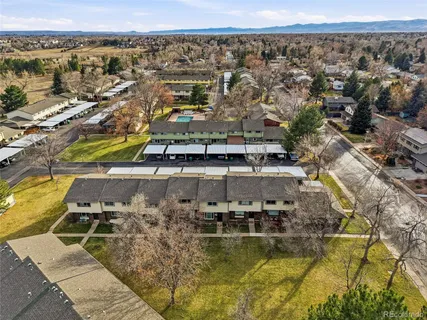 an aerial view of residential houses with outdoor space