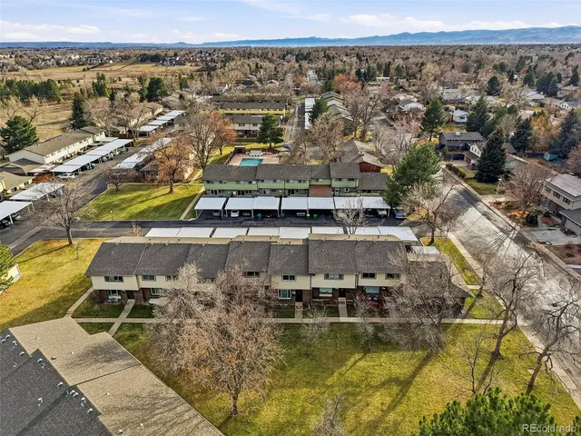 an aerial view of residential houses with outdoor space