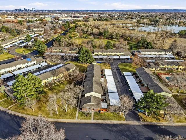 an aerial view of residential houses with outdoor space