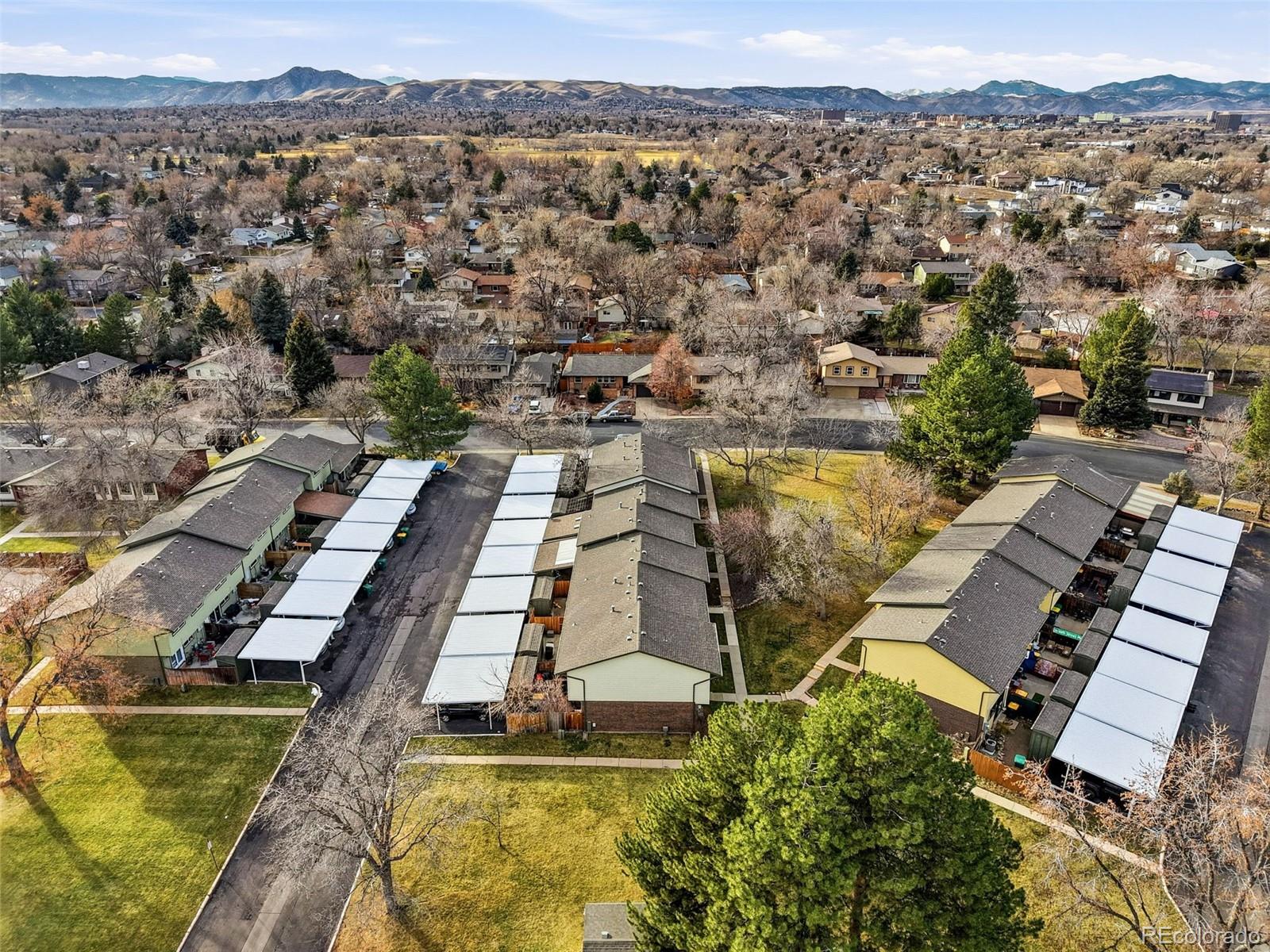 508 South Carr Street, Unit 118 Lakewood, CO 80226 - Photo 37 of 42 an aerial view of a residential apartment building with a yard