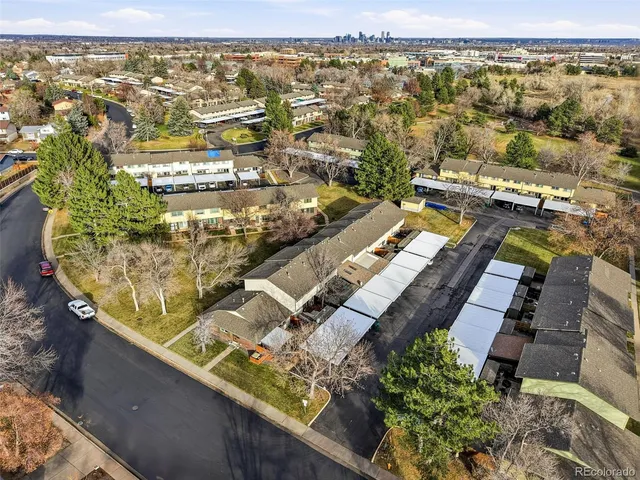 an aerial view of residential houses with outdoor space