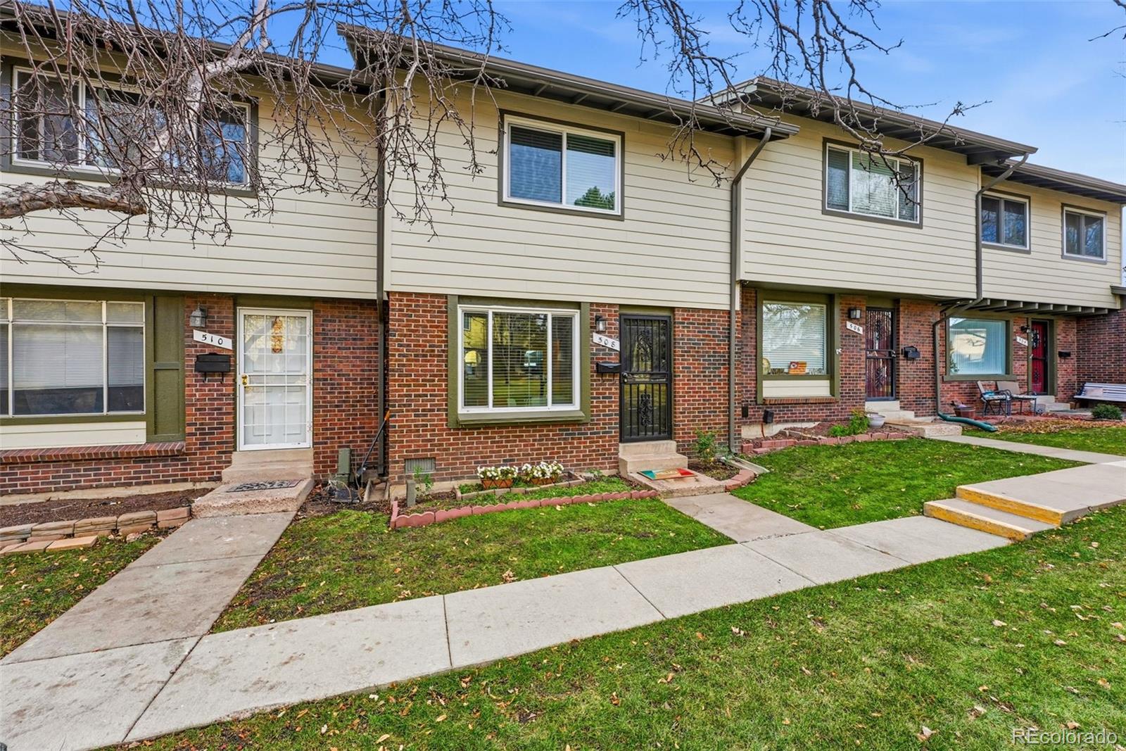 508 South Carr Street, Unit 118 Lakewood, CO 80226 - Photo 4 of 42 a front view of a house with a yard