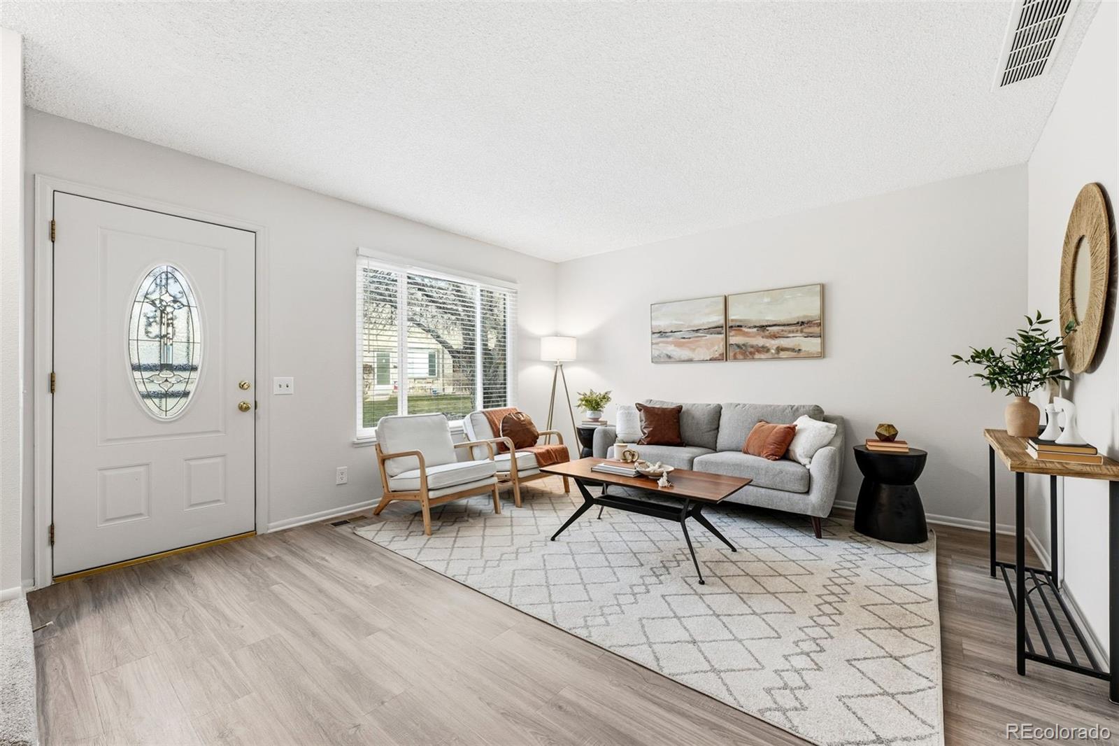 508 South Carr Street, Unit 118 Lakewood, CO 80226 - Photo 7 of 42 a living room with furniture and wooden floor