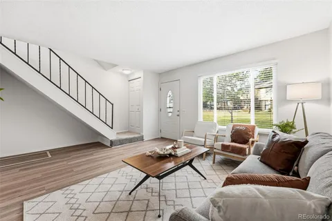 a living room with furniture and a table