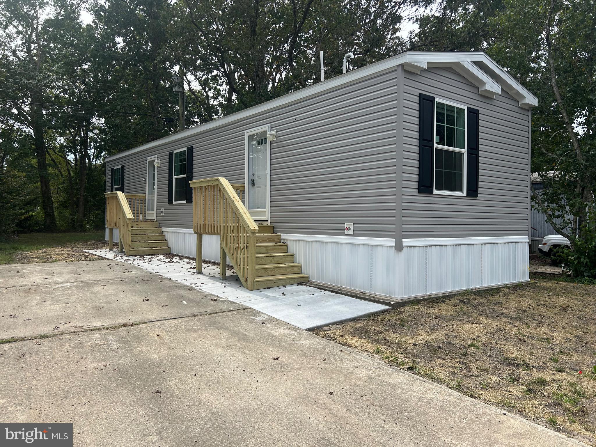 2501 Tilton Road, Unit 117 Egg Harbor Township, NJ 08234 - Photo 1 of 16 a view of a house with backyard and trees