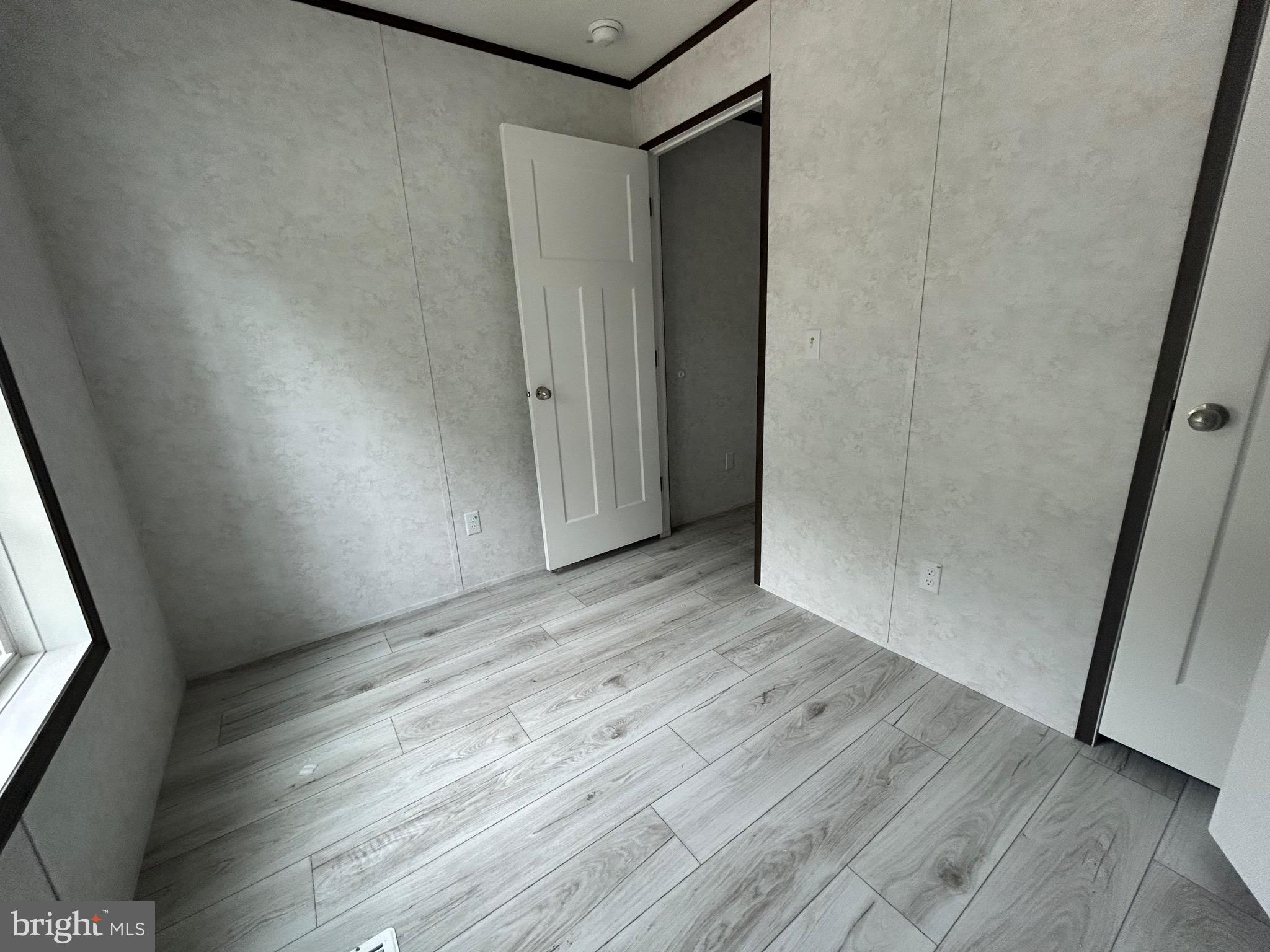 2501 Tilton Road, Unit 117 Egg Harbor Township, NJ 08234 - Photo 14 of 16 a view of hallway with wooden floor