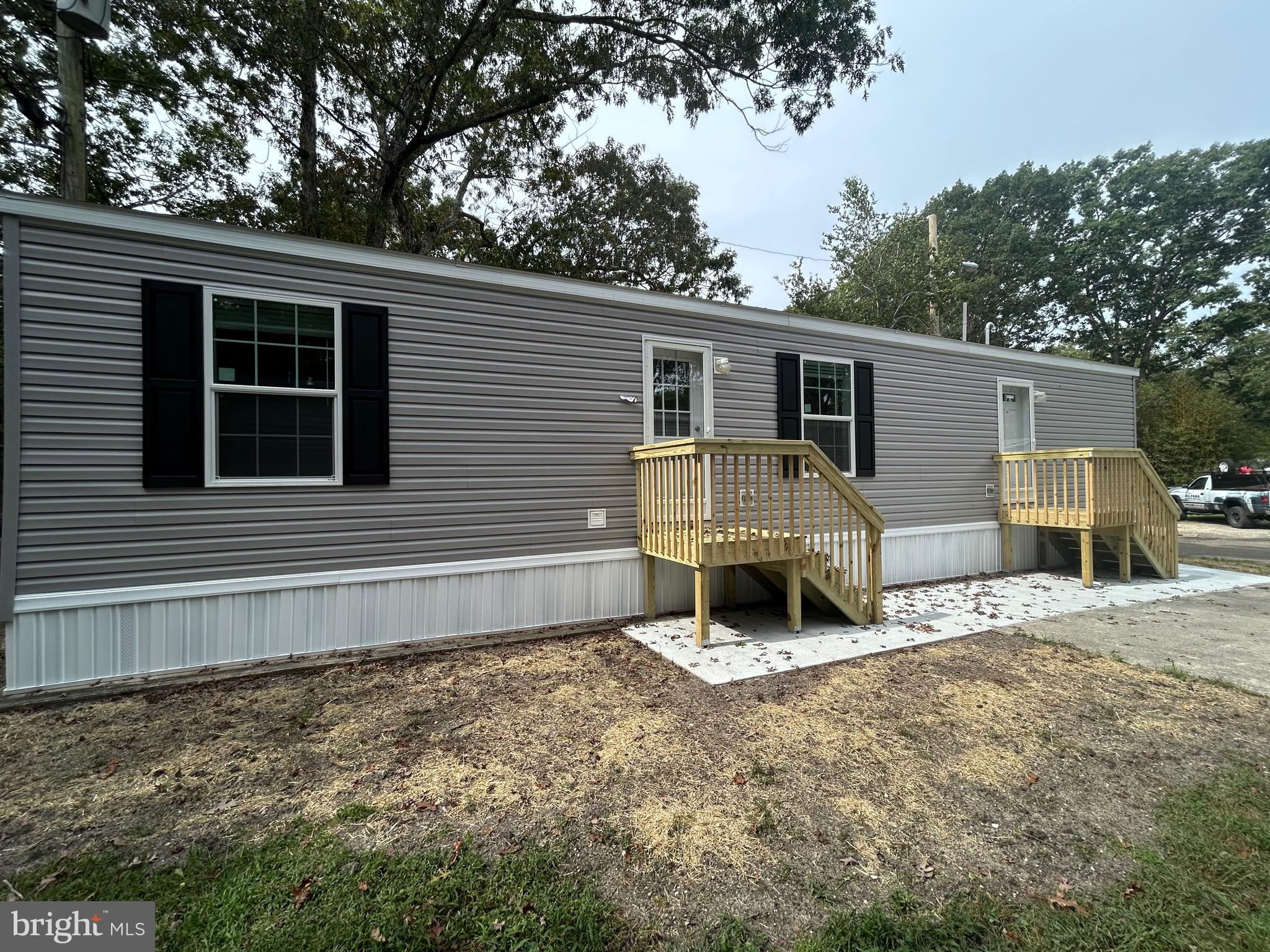 2501 Tilton Road, Unit 117 Egg Harbor Township, NJ 08234 - Photo 3 of 16 a view of a house with a patio and a yard