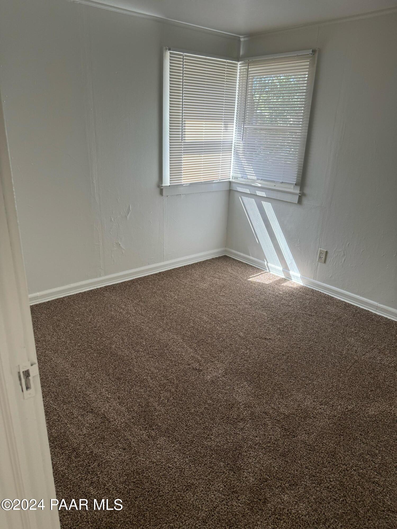 818 West Rosser Street Prescott, AZ 86301 - Photo 2 of 7 an empty room with windows