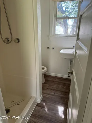 a bathroom with a sink and toilet
