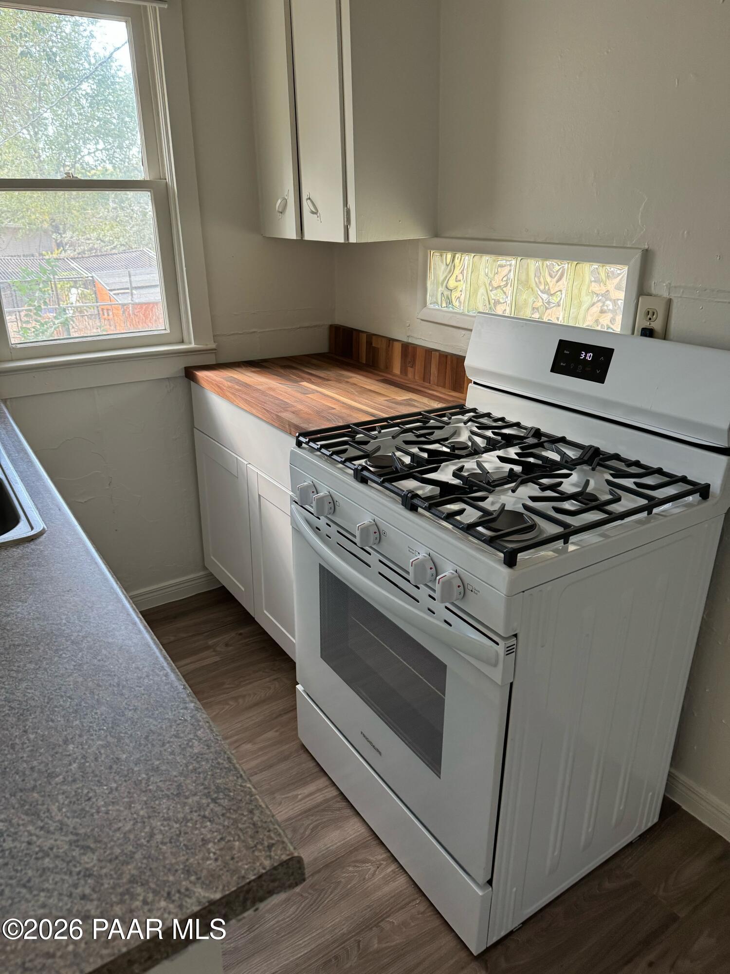 818 West Rosser Street Prescott, AZ 86301 - Photo 6 of 7 a white stove top oven sitting inside of a kitchen