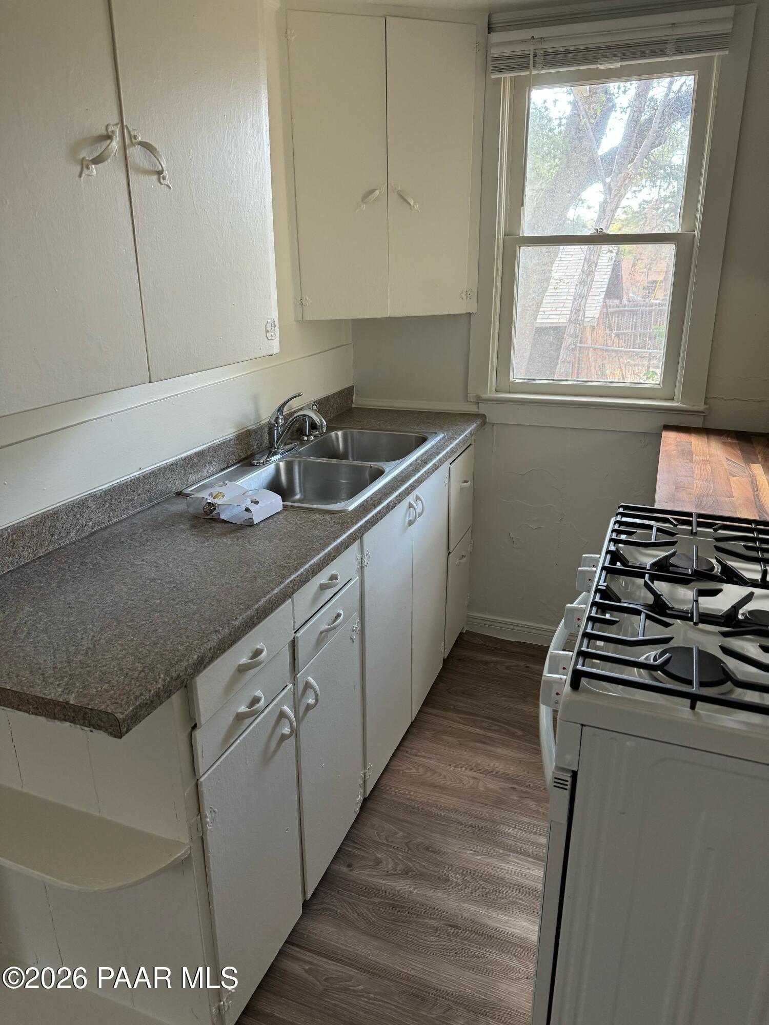 818 West Rosser Street Prescott, AZ 86301 - Photo 7 of 7 a kitchen with sink a stove and a window