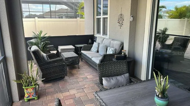 a view of a dining room with furniture window and outside view