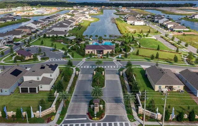 an aerial view of a house with outdoor space swimming pool