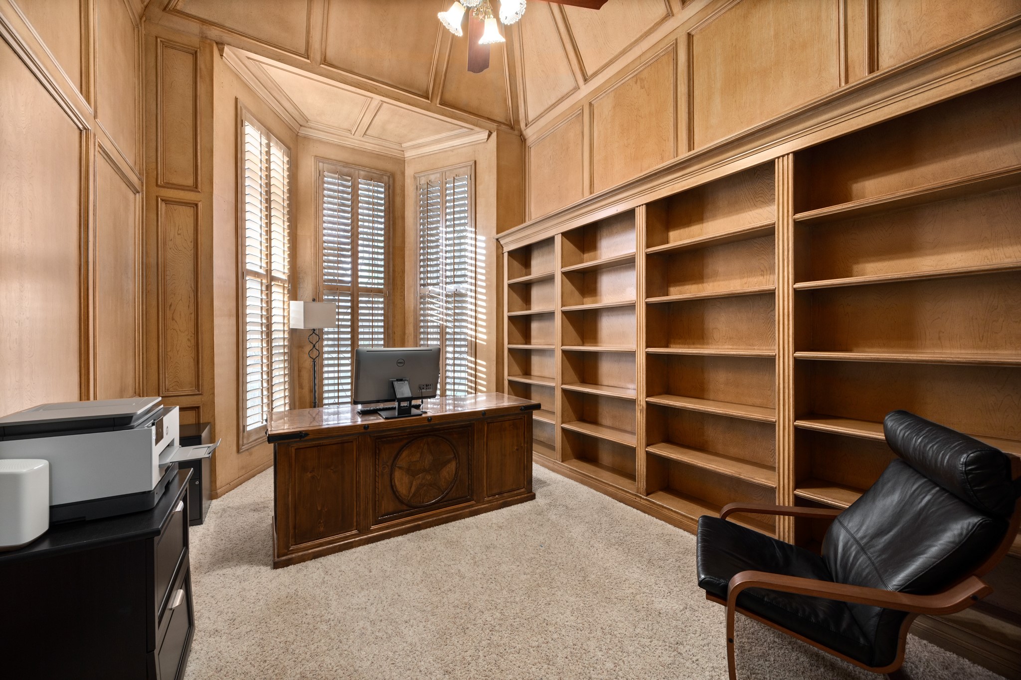 8807 Chelmsford Lane Spring, TX 77379 - Photo 22 of 50 On the first floor tucked away from the entertaining spaces is the absolutely gorgeous home office featuring incredible wood work and two story ceilings.