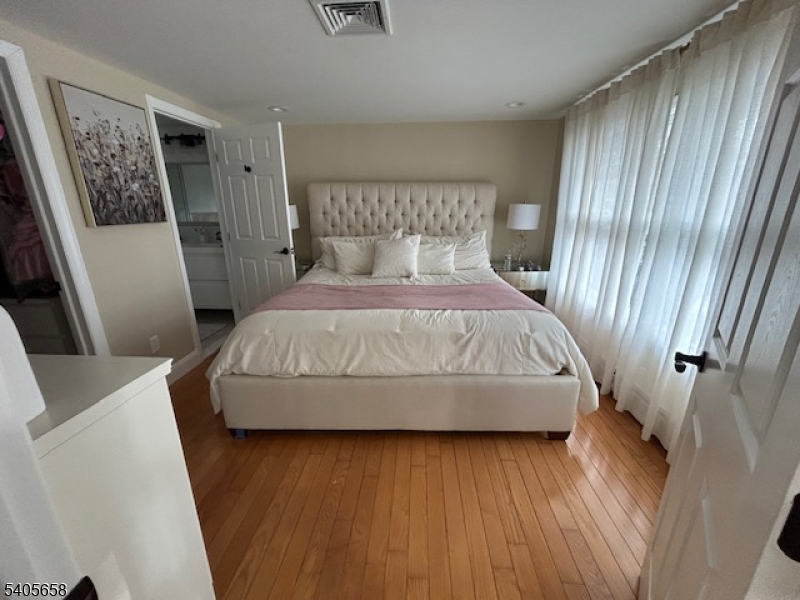 23 Old Farm Road Berkeley Heights, NJ 07922 - Photo 18 of 28 a bedroom with a bed and a mirror
