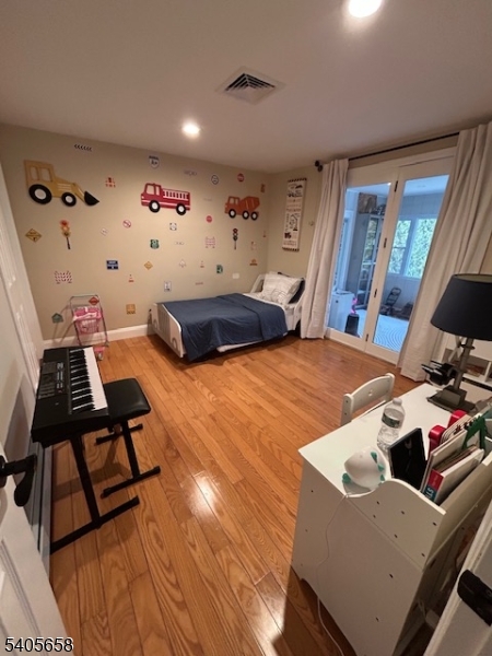 23 Old Farm Road Berkeley Heights, NJ 07922 - Photo 20 of 28 a bedroom with a bed and wooden floor