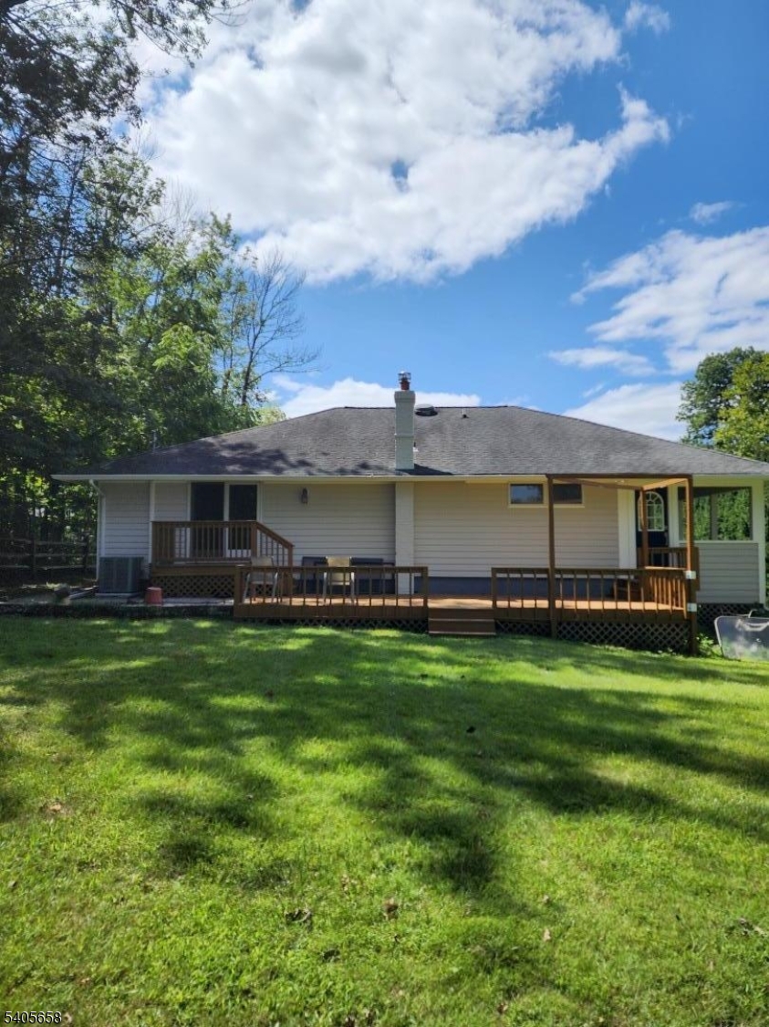 23 Old Farm Road Berkeley Heights, NJ 07922 - Photo 2 of 28 a view of a house with a big yard and a large tree