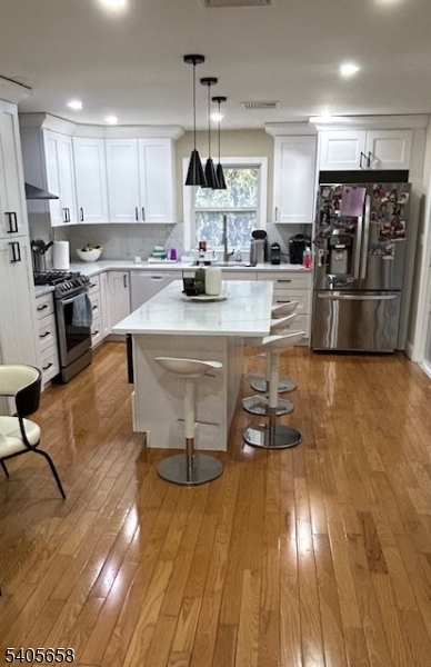 23 Old Farm Road Berkeley Heights, NJ 07922 - Photo 26 of 28 a kitchen with counter top space a sink and appliances