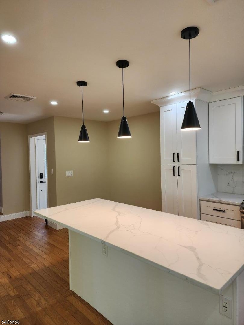 23 Old Farm Road Berkeley Heights, NJ 07922 - Photo 6 of 28 a kitchen with stainless steel appliances kitchen island a chandelier