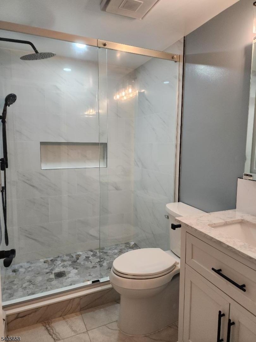 23 Old Farm Road Berkeley Heights, NJ 07922 - Photo 9 of 28 a bathroom with a sink a toilet and shower