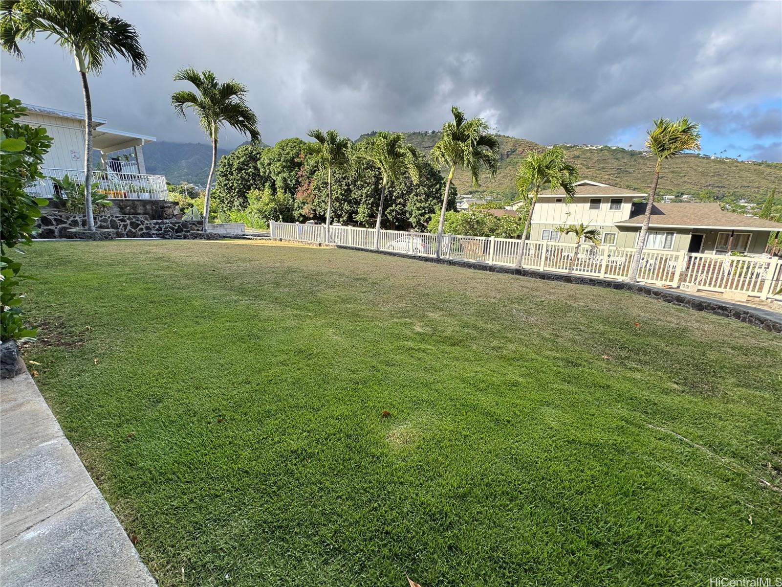 320 Hao Street Honolulu, HI 96821 - Photo 2 of 15 a view of a big yard with a building in the background