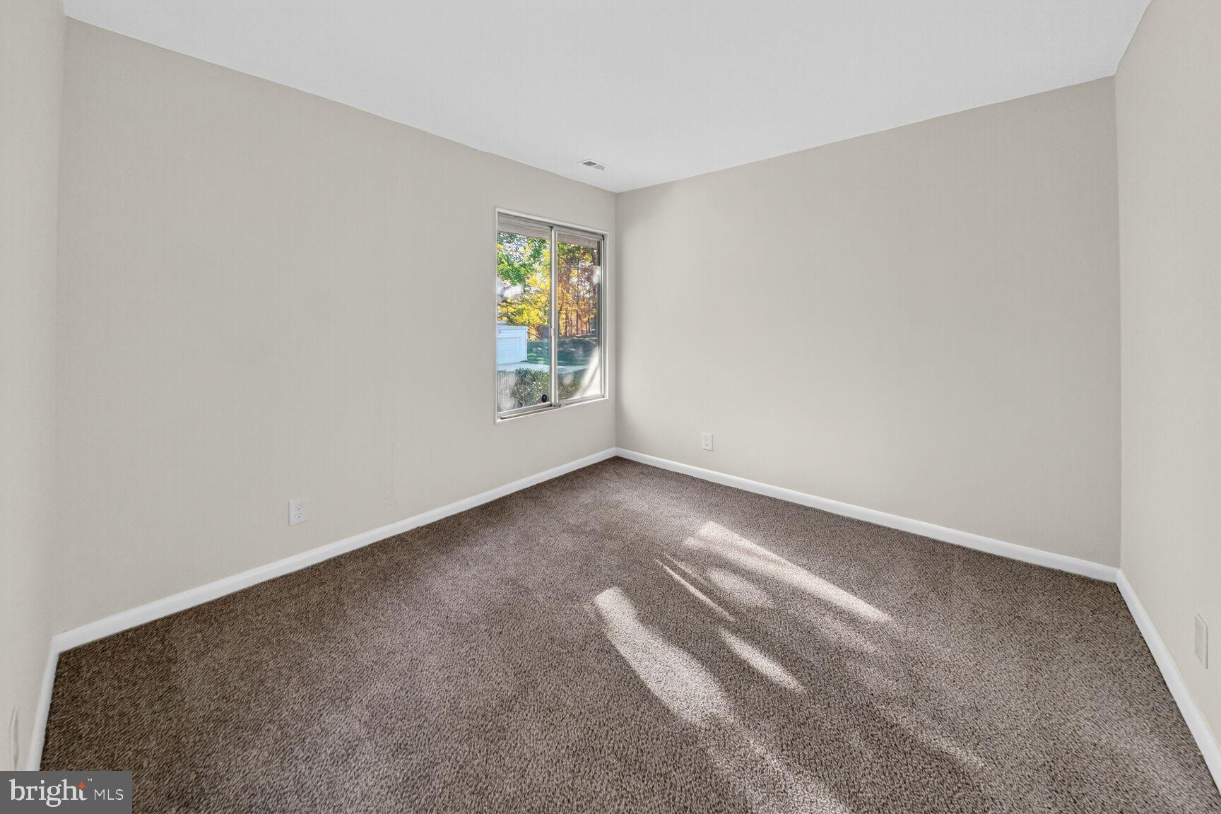 14507 Elmhan Court, Unit 182B Silver Spring, MD 20906 - Photo 14 of 21 an empty room with windows