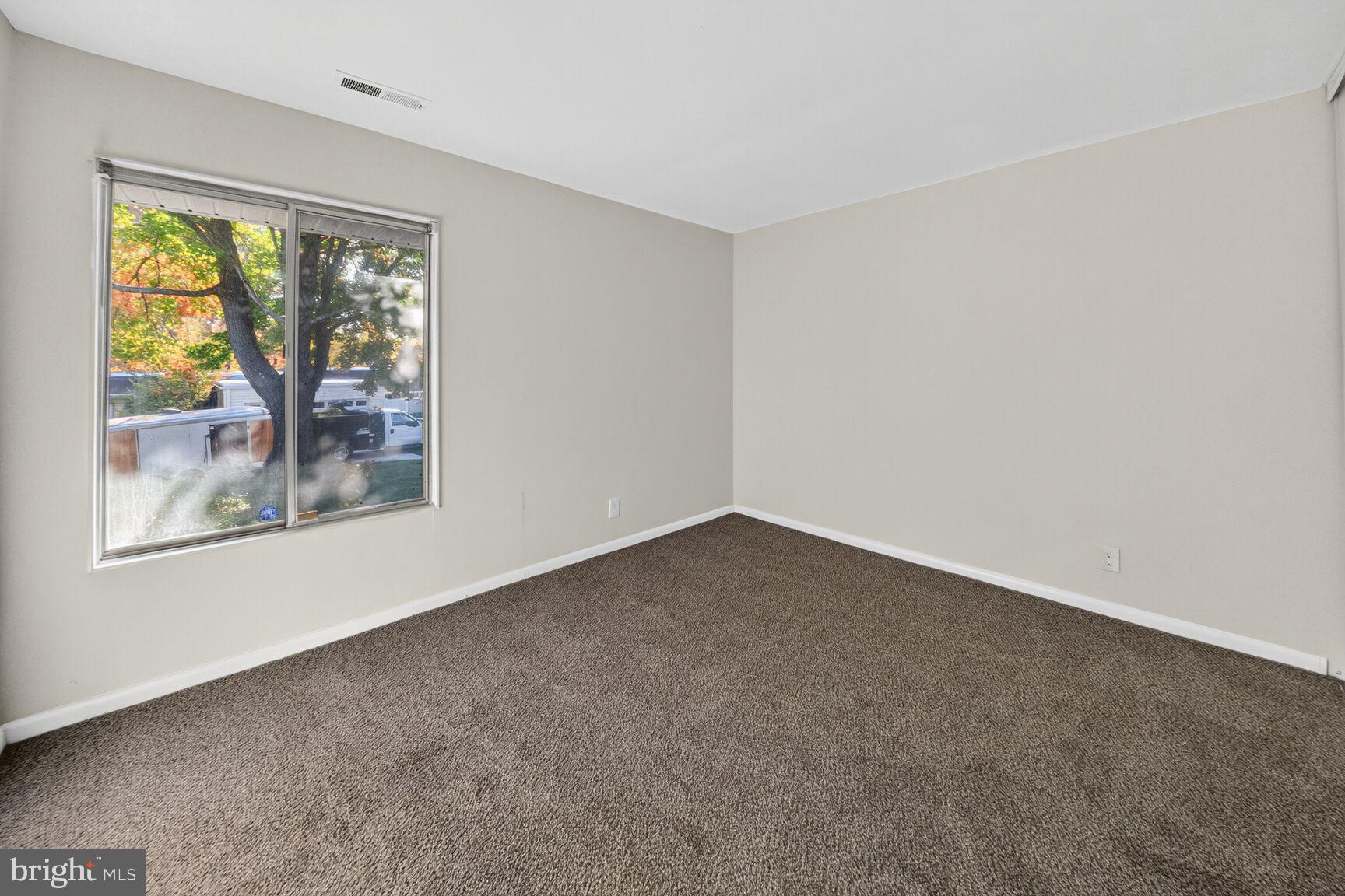 14507 Elmhan Court, Unit 182B Silver Spring, MD 20906 - Photo 15 of 21 an empty room with windows