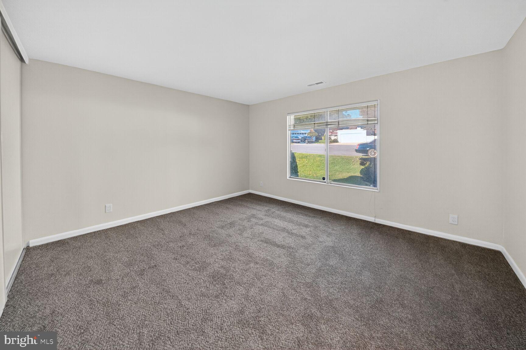 14507 Elmhan Court, Unit 182B Silver Spring, MD 20906 - Photo 17 of 21 a view of an empty room with a window