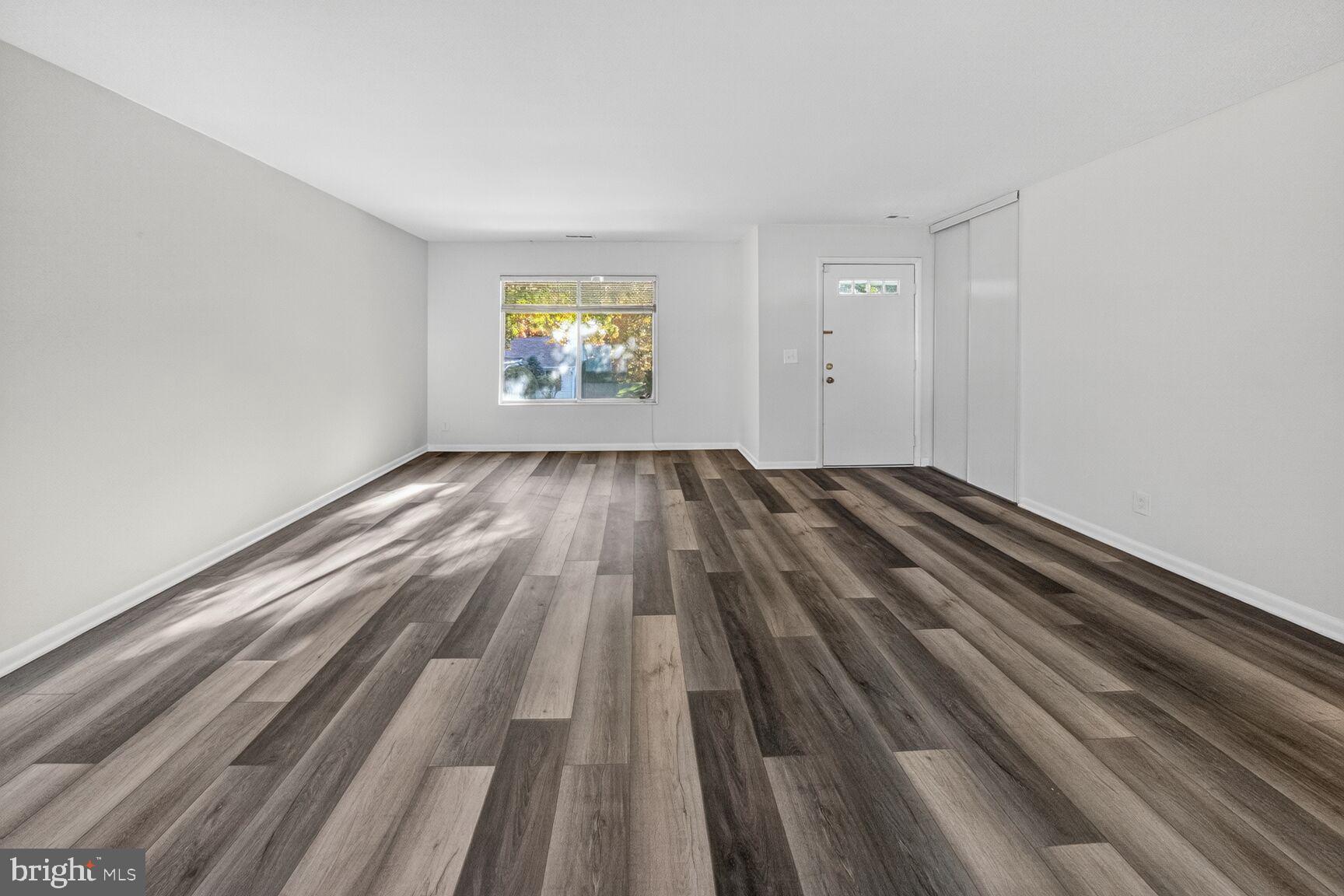 14507 Elmhan Court, Unit 182B Silver Spring, MD 20906 - Photo 5 of 21 a view of empty room with wooden floor