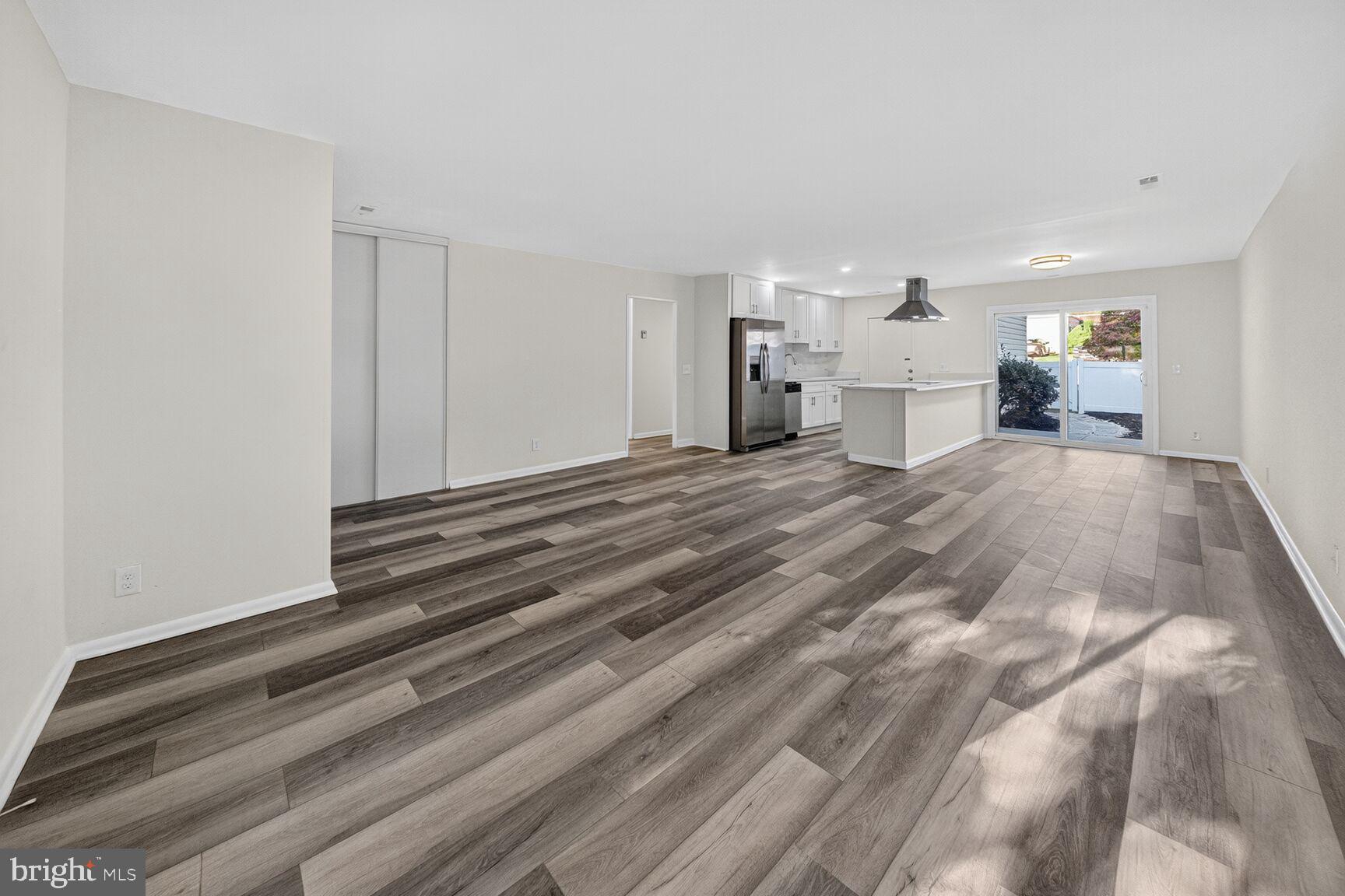 14507 Elmhan Court, Unit 182B Silver Spring, MD 20906 - Photo 6 of 21 a spacious bedroom with a bed and a lamp on dresser
