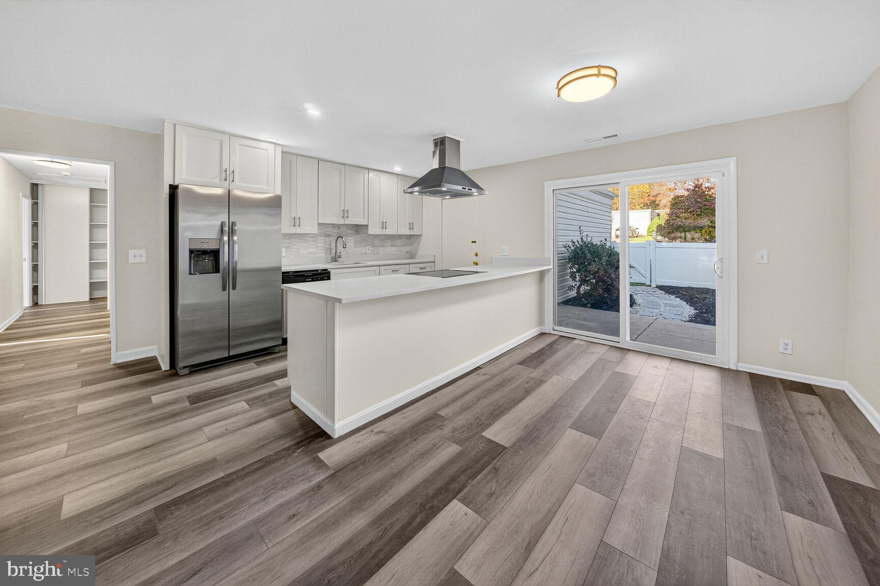 14507 Elmhan Court, Unit 182B Silver Spring, MD 20906 - Photo 7 of 21 a large kitchen with a lot of counter space and stainless steel appliances