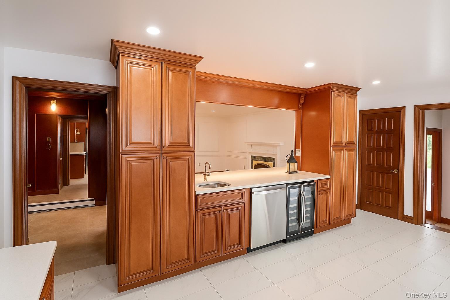285 Goff Road Livingston Manor, NY 12758 - Photo 10 of 24 Kitchen with dishwasher, winecooler, brown cabinetry,baseboard heating, andrecessed lighting