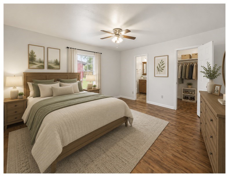 435 Rolling Wood Road Baytown, TX 77520 - Photo 22 of 31 a bedroom with a large bed and a chandelier