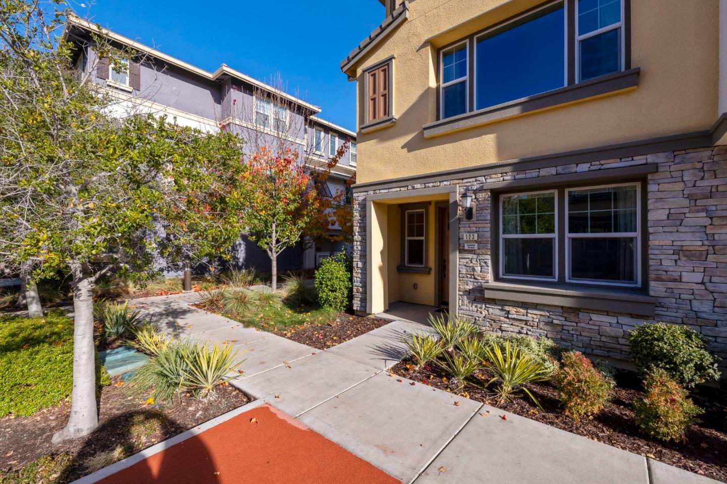 a view of a brick building with large windows