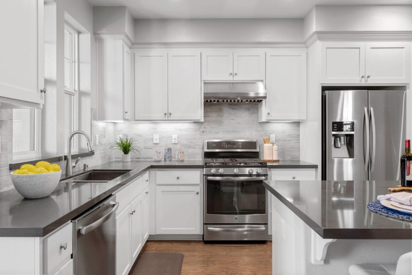 123 Lemmon Terrace Sunnyvale, CA 94086 - Photo 12 of 42 a kitchen with stainless steel appliances granite countertop a sink stove and refrigerator