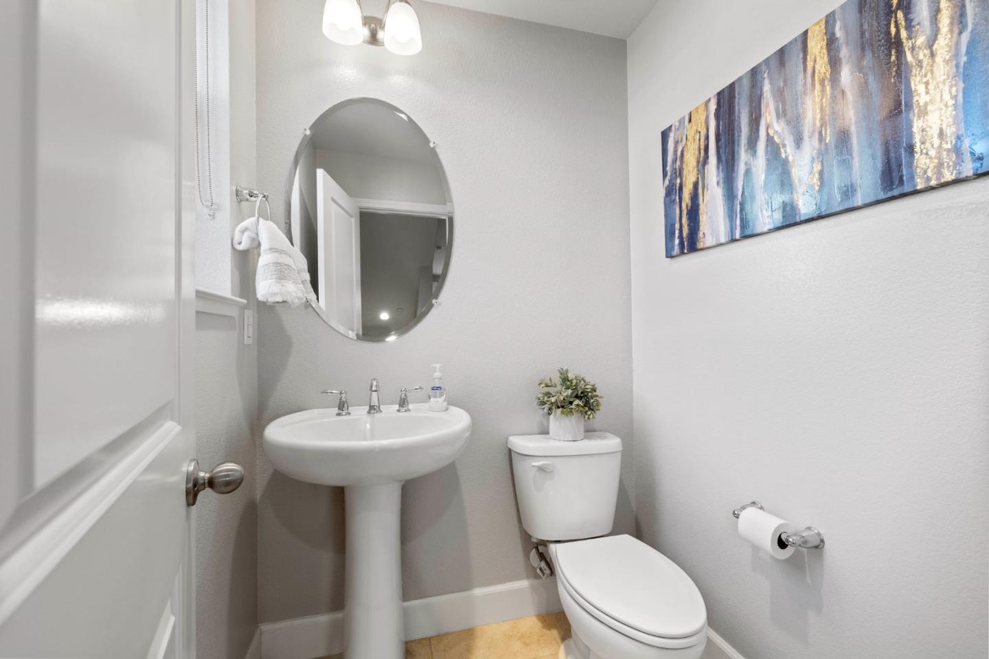 123 Lemmon Terrace Sunnyvale, CA 94086 - Photo 15 of 42 a bathroom with a toilet sink and mirror